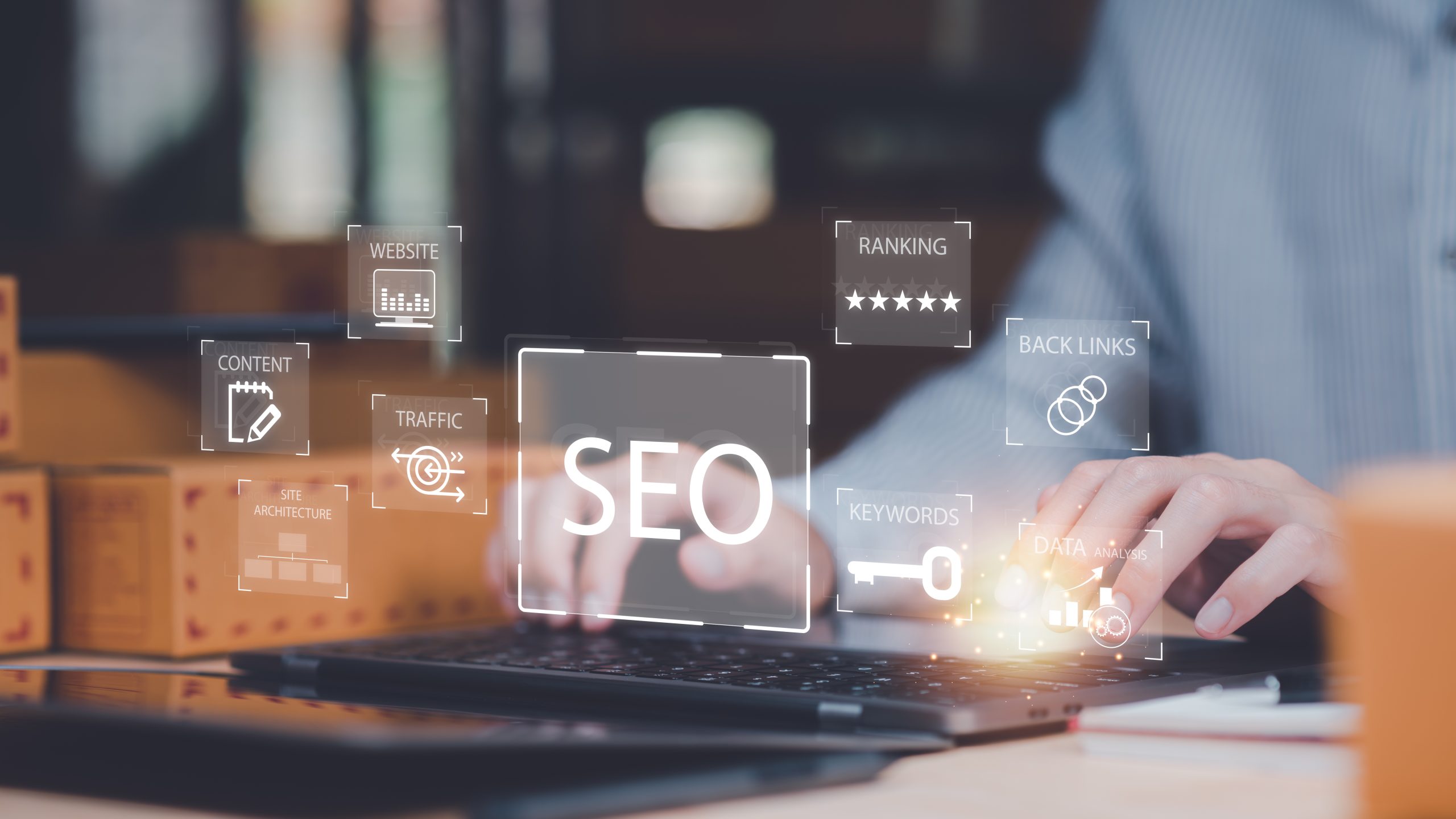 A person typing on a laptop with glowing digital icons representing SEO concepts, including keywords, backlinks, website ranking, traffic, and content strategy, symbolizing online search optimization and data analysis.