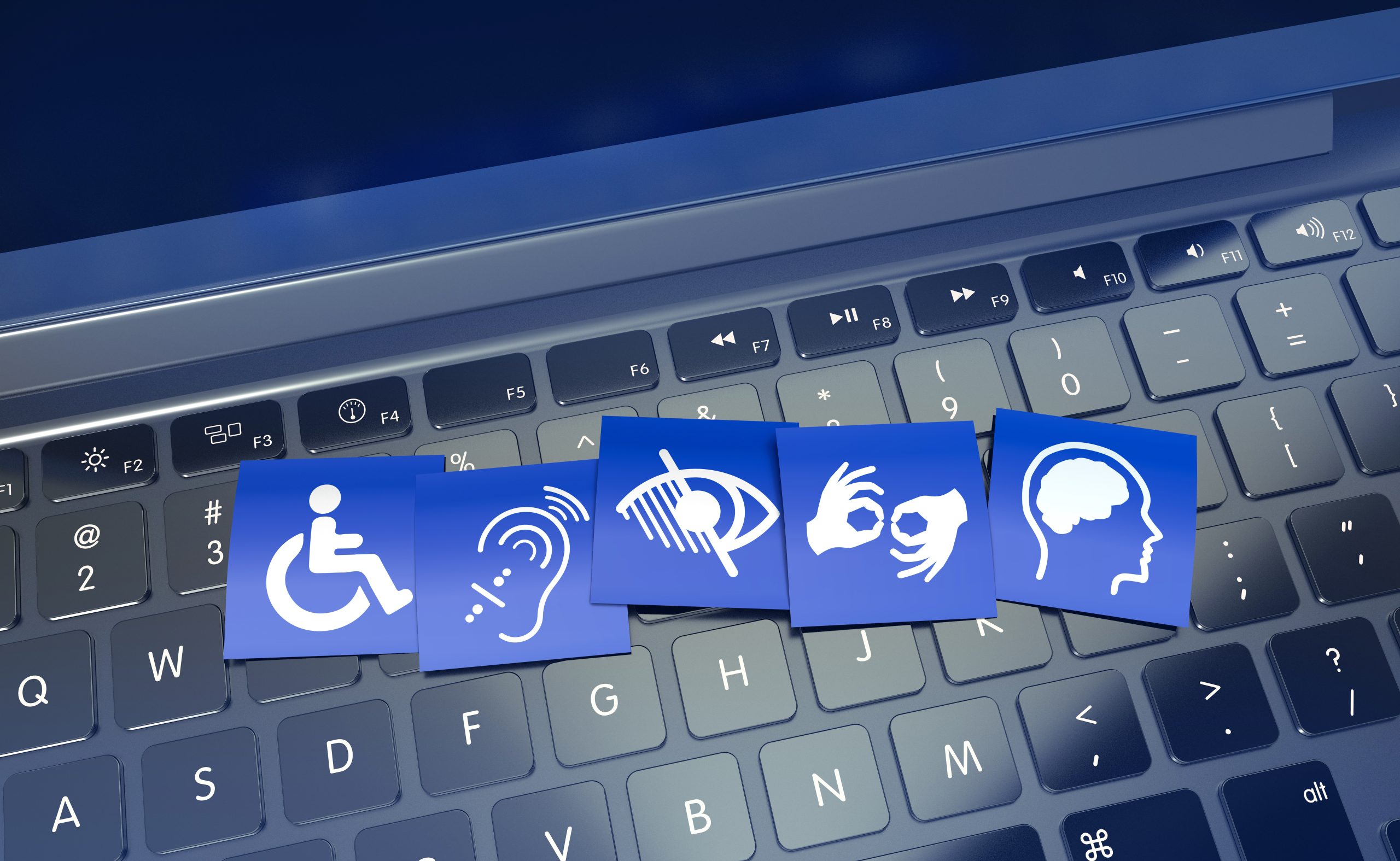 ccessibility icons representing wheelchair access, hearing assistance, visual impairment, sign language, and cognitive accessibility displayed on blue cards over a computer keyboard, symbolizing inclusive web design and better usability for all users.